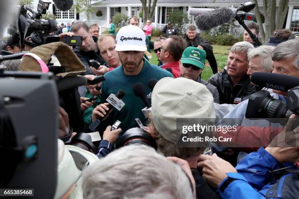 Dustin Johnson of the United States talks to the media announcing his withdrawl during the first round of the 2017 Masters Tournament at Augusta...