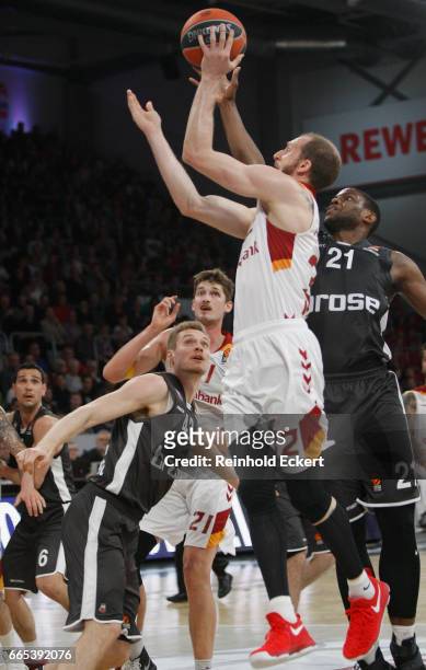 Sinan Guler, #32 of Galatasaray Odeabank Istanbul competes with Darius Miller, #21 of Brose Bamberg in action during the 2016/2017 Turkish Airlines...