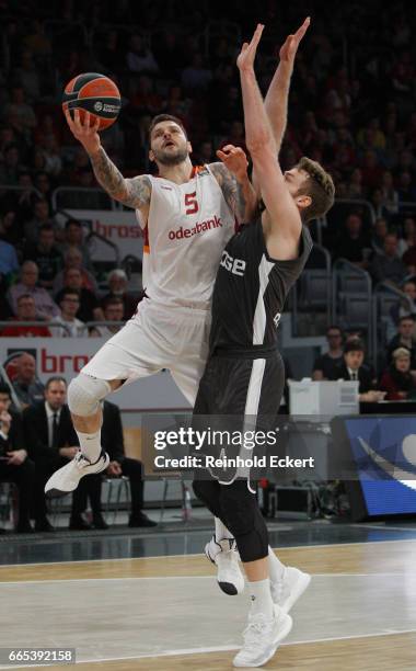 Vladimir Micov, #5 of Galatasaray Odeabank Istanbul competes with Nicolo Melli, #4 of Brose Bamberg in action during the 2016/2017 Turkish Airlines...