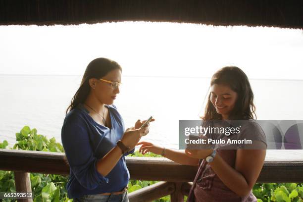 two youg girls enjoying in the amazon in brazil - amazon jungle girl stockfoto's en -beelden