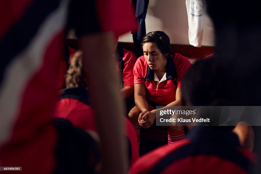 Female rugby player getting ready before match