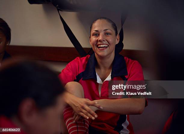 rugby player laughing in changing room - rugby portraits stock-fotos und bilder