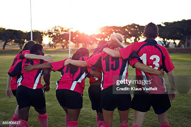 womens rugby team walking together towards sunset - women rugby stock pictures, royalty-free photos & images