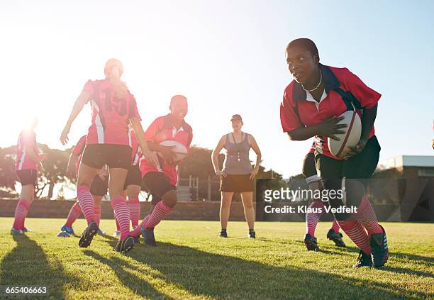 rugby players practicing in the field - women rugby stock pictures, royalty-free photos & images