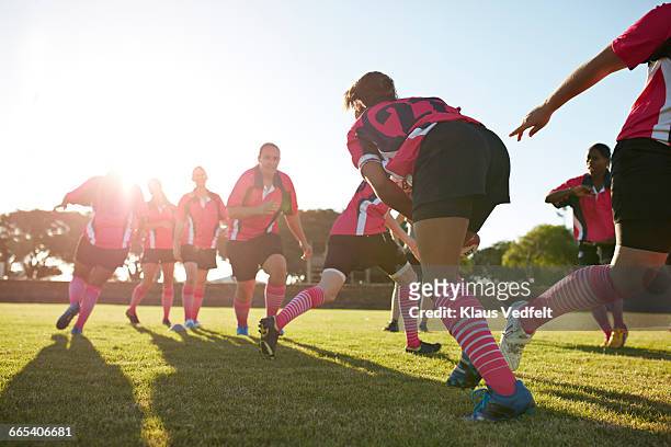 rugby players practicing in the field - amateur rugby stock pictures, royalty-free photos & images