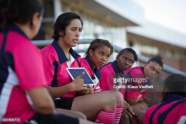captain of rugby team explaning strategy to team - team captain sport stock pictures, royalty-free photos & images
