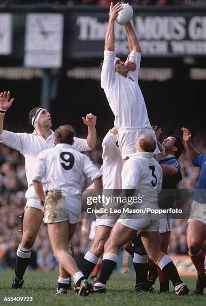 English rugby union lock forward Paul Ackford pictured in action leaping to win the ball for England in the 1989 Five Nations Championship match...