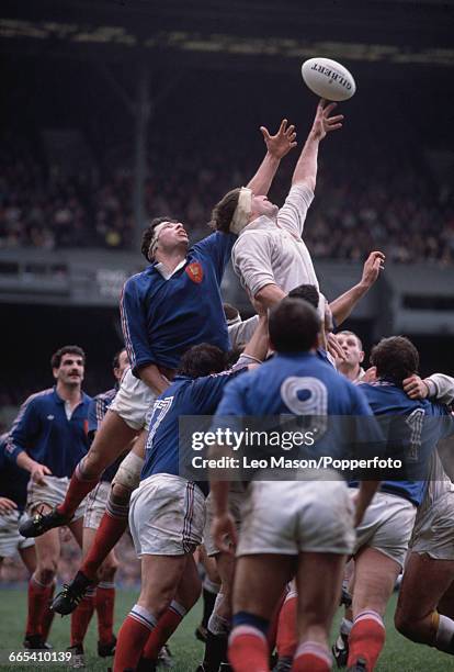 English rugby union lock forward Paul Ackford pictured in action leaping to win the ball for England in the 1989 Five Nations Championship match...