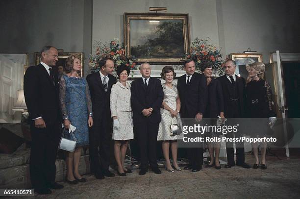 S triumphant American Apollo 11 astronauts and their wives line up together with British Prime Minister Harold Wilson during a visit to 10 Downing...