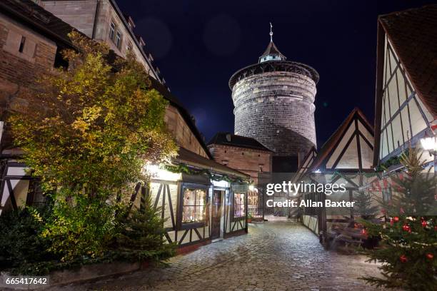 medieval nuremburg city fortifications illuminated at night - nuremberg stock-fotos und bilder