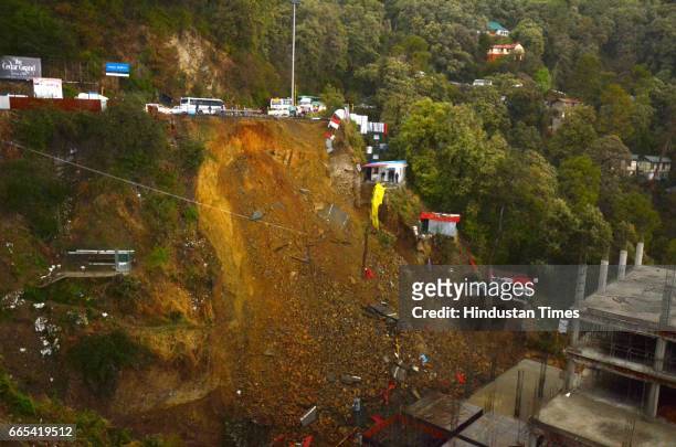 Road damaged due to landslide after the heavy rainfall near Tutikandi, on April 6, 2017 in Shimla, India.