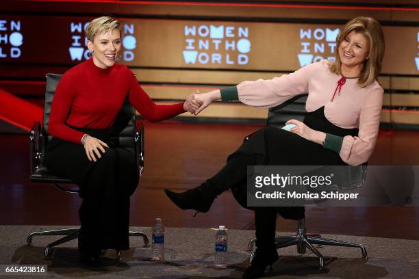 Scarlett Johansson speaks with Arianna Huffington on stage at the 8th Annual Women In The World Summit at Lincoln Center for the Performing Arts on...