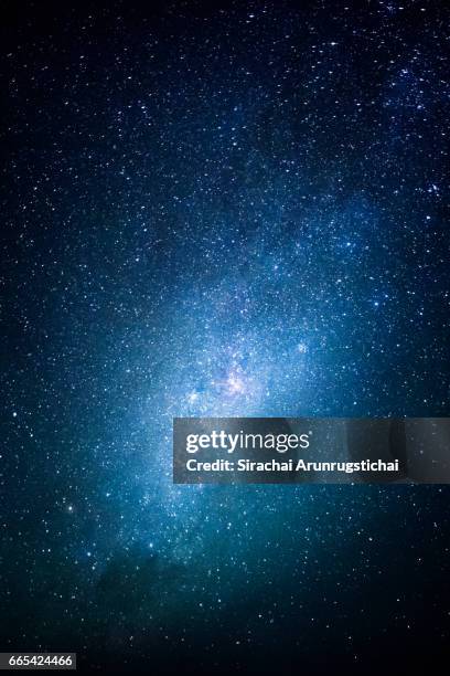 milky way over the night sky - blue galaxy stock pictures, royalty-free photos & images