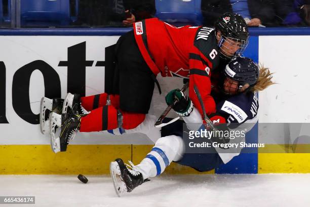 Rebecca Johnston of Canada battles for the puck with Anna Kilponen of Finland in the second period during a semifinal game at the 2017 IIHF Womans...