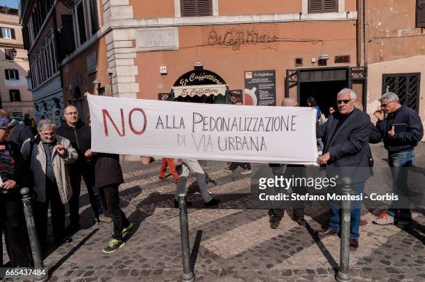 Residents from the Monti district protest against the creation of a pedestrian zone in via Urbana, as Mayor of Rome Virginia Raggi (not pictured...