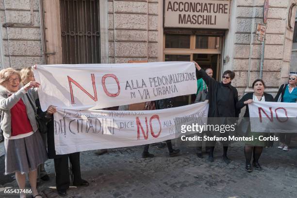 Residents from the Monti district protest against the creation of a pedestrian zone in via Urbana, as Mayor of Rome Virginia Raggi (not pictured...
