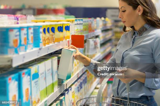 buying baby food - baby food stock pictures, royalty-free photos & images