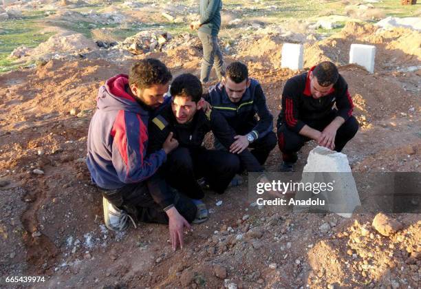 Abdel Hameed Alyousef mourns over his wife and twin babies, killed in the chemical attack by Assad Regime, at their cemetery in Idlib, Syria on April...