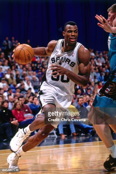 David Robinson of the San Antonio Spurs drives against the Vancouver Grizzlies on December 17, 1997 at the Alamodome in San Antonio, Texas. NOTE TO...