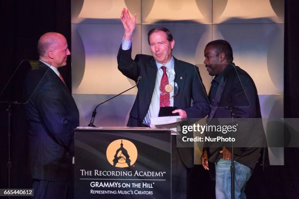 , John Poppo, Recording Academy board member, and Rodney Jerkins, music producer, presented Senator Tom Udall , with the 2017 Grammys on the Hill...