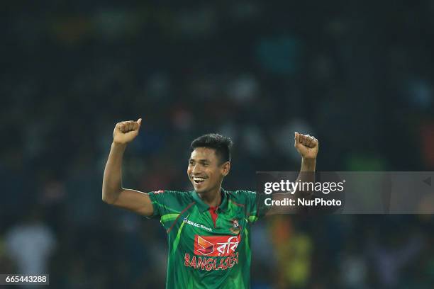 Bangladesh's Mustafizur Rahman celebrates Sri Lanka's Chamara Kapugedera is dismissed during the 2nd and final T-20 International cricket match...