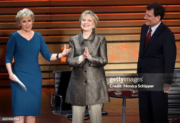 Tina Brown, former United States Secretary of State Hillary Clinton and journalist Nicholas Kristof speak on stage at the 8th Annual Women In The...