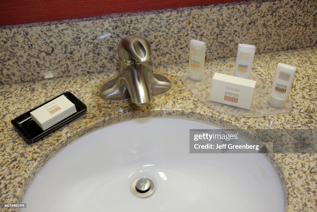 A sink in a bathroom at West Miami Courtyard by Marriott.