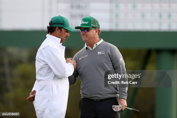 Charley Hoffman of the United States and caddie Brett Waldman react on the 18th hole during the first round of the 2017 Masters Tournament at Augusta...