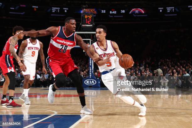 Courtney Lee of the New York Knicks handles the ball against Ian Mahinmi of the Washington Wizards during a game on April 6, 2017 at Madison Square...