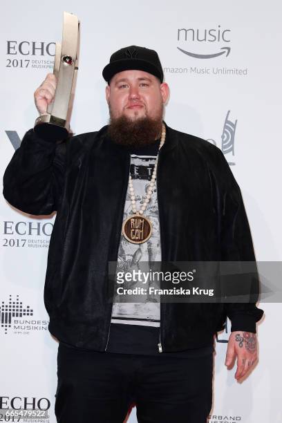 British singer Rag'n'Bone Man poses with his award at the Echo award winners board on April 6, 2017 in Berlin, Germany.