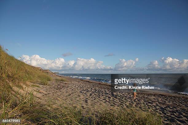 girl playing on beach, blowing rocks preserve, jupiter island, florida, usa - blowing rocks preserve stock pictures, royalty-free photos & images