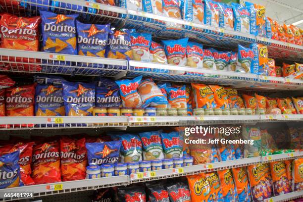 Shelves of potato chips for sale at Walmart.