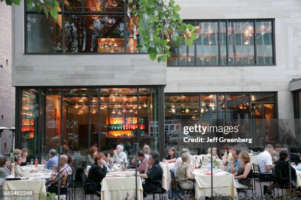 Montreal, Rue Jeanne Mance, people dining at restaurant.