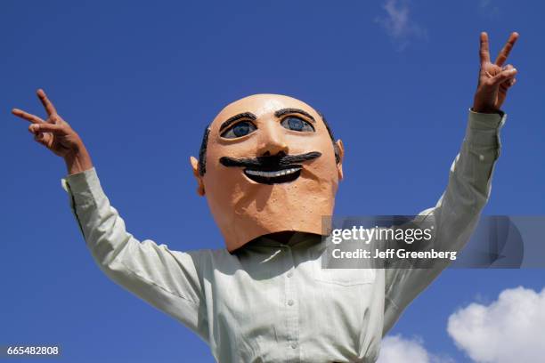 Former Mexican president paper-mache mask parading at Arts in the Street, Independence of Central America & Mexico Cultural Integration Day.