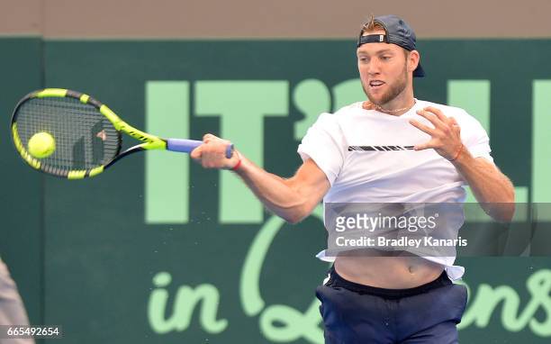 Jack Sock of the USA plays a forehand in his match against Jordan Thompson of Australia during the Davis Cup World Group Quarterfinals between...