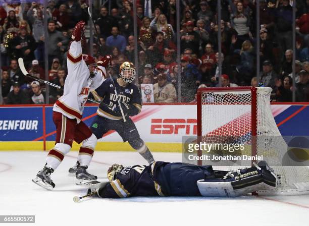 Tariq Hammond of the Denver Pioneers celebrates scoring a second period goal against Cal Petersen of the Notre Dame Fighting Irish during game two of...