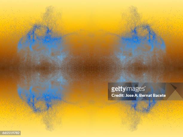 explosion of water drops of  color blue, floating in the air  on a orange background - partícula stock-fotos und bilder