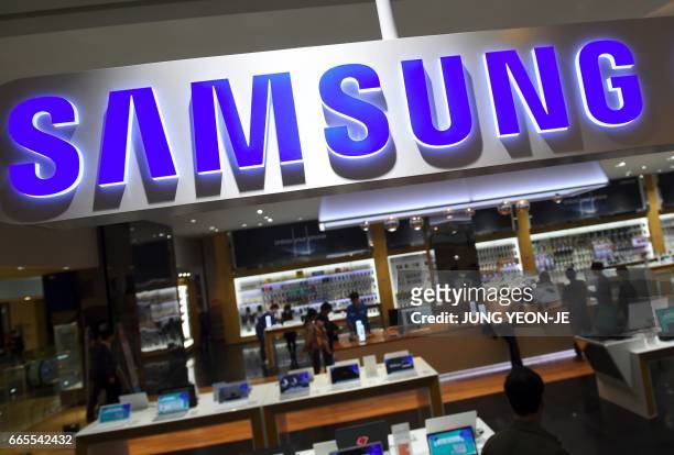 The logo of Samsung is seen at a Samsung showroom in Seoul on April 7, 2017. Samsung Electronics said on April 7 it expects profits to soar by 48.2...