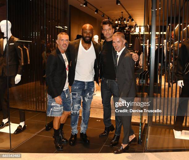 Fashion designer Dan Caten, actor/model Tyson Beckford, recording artist Ricky Martin and fashion designer Dean Caten attend the grand opening party...