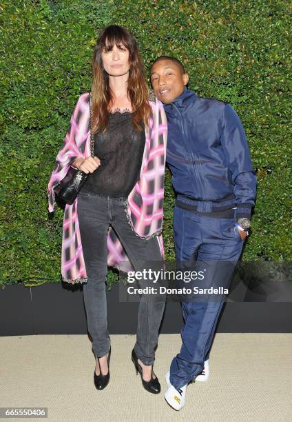 Caroline De Maigret and Pharrell Williams attend Caroline De Maigret and Pharrell Williams dinner in celebration of CHANEL's Gabrielle Bag at Giorgio...