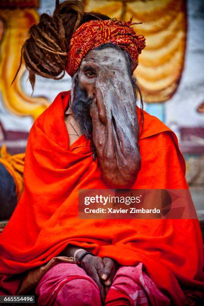 This sadhu, nicknamed Elephant Man, is suffering from neurofibromatosis and adored by the Hindu pilgrims as he looks like Ganesh, the God with an...