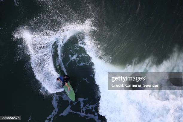 Surfer rides a wave at Snapper Rocks on April 7, 2017 in Gold Coast, Australia. The 2018 Commonwealth Games will be held on the Gold Coast from April...