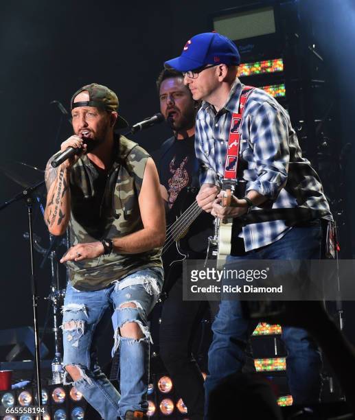 Preston Burst and Chris Lucas of LoCash joined onstage by Tim Richards PD KMLE Country Radio 107.9FM perform during Day 1 - Country Thunder Music...