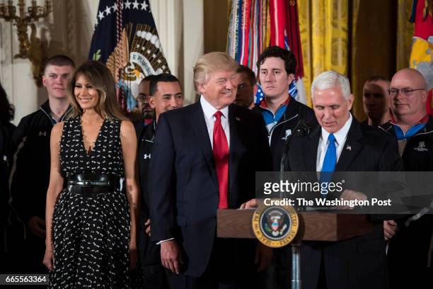 President Donald Trump and first lady Melania Trump listens as Vice President Mike Pence speaks during a Wounded Warrior Project Soldier Ride event...