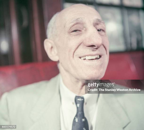 Abe Attell, the greatest featherweight boxer that ever lived poses for a portrait while eating with friends at Jack Dempsey's resturant in New York,...
