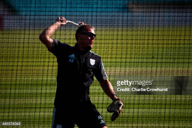Surrey's Assistant head coach Alec Stewart warms players up in the net ahead of the Specsavers County Championship Division One match between Surrey...