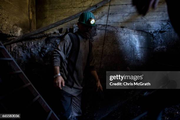 Coal miner works at the entrance to a mine shaft at a small mine on April 3, 2017 in Zonguldak, Turkey. More than 300 kilometers of coal mineÕs...