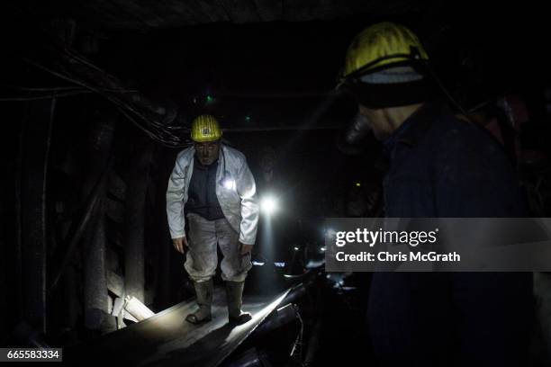 Coal miner is seen riding a conveyor belt towards the surface at a large government run coal mine on April 4, 2017 in Zonguldak, Turkey. More than...