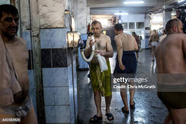 Coal miner uses a hair dryer after finishing his shift underground at a large government run coal mine on April 4, 2017 in Zonguldak, Turkey. More...