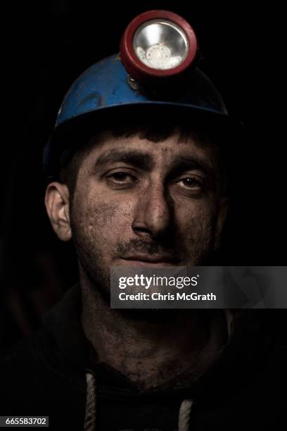 Coal miner, Savas, poses for a portrait on his night shift break at a small mine on April 5, 2017 in Zonguldak, Turkey. More than 300 kilometers of...